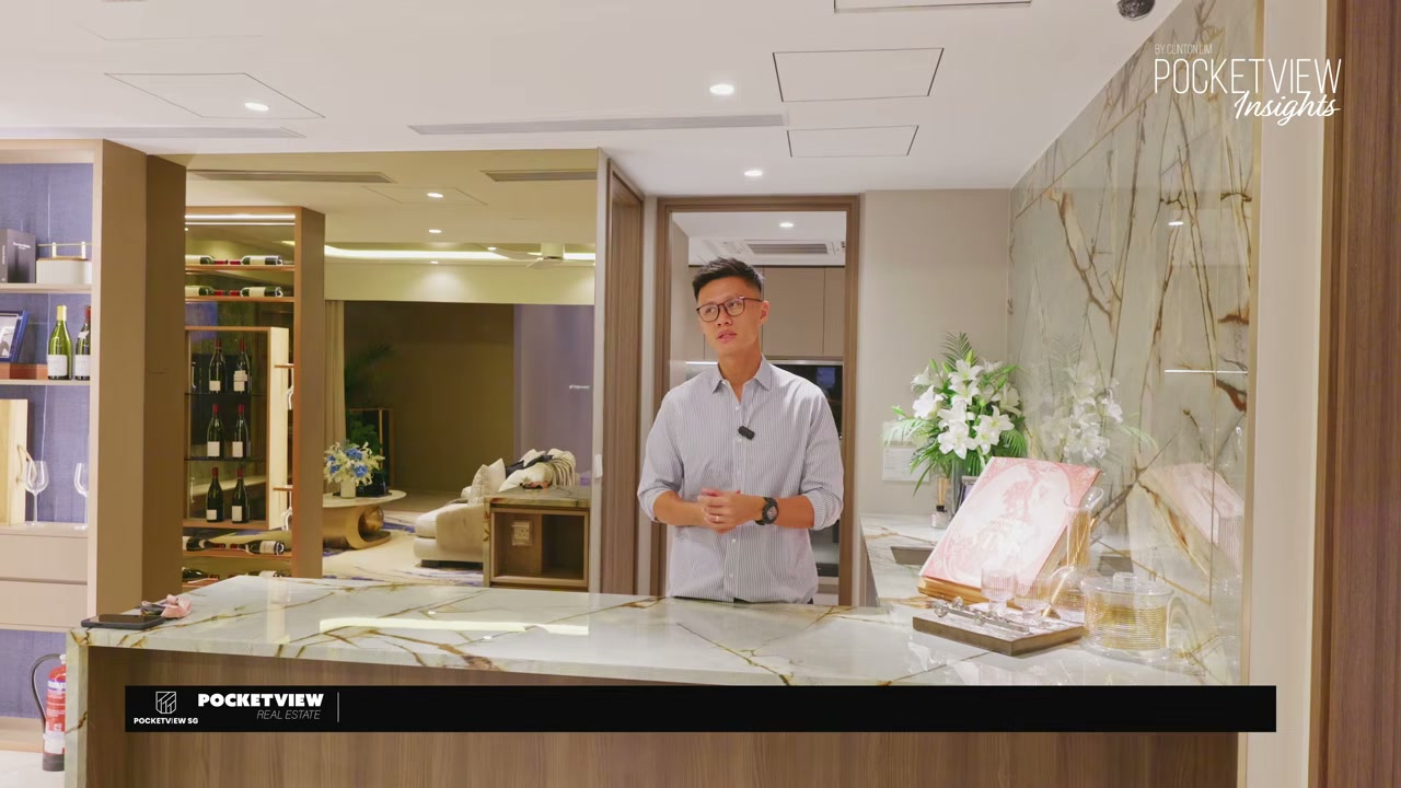 Clinton Lim of PocketView at the start of EP 77, standing in the show flat dry kitchen with marble countertops and a wine display behind him.
