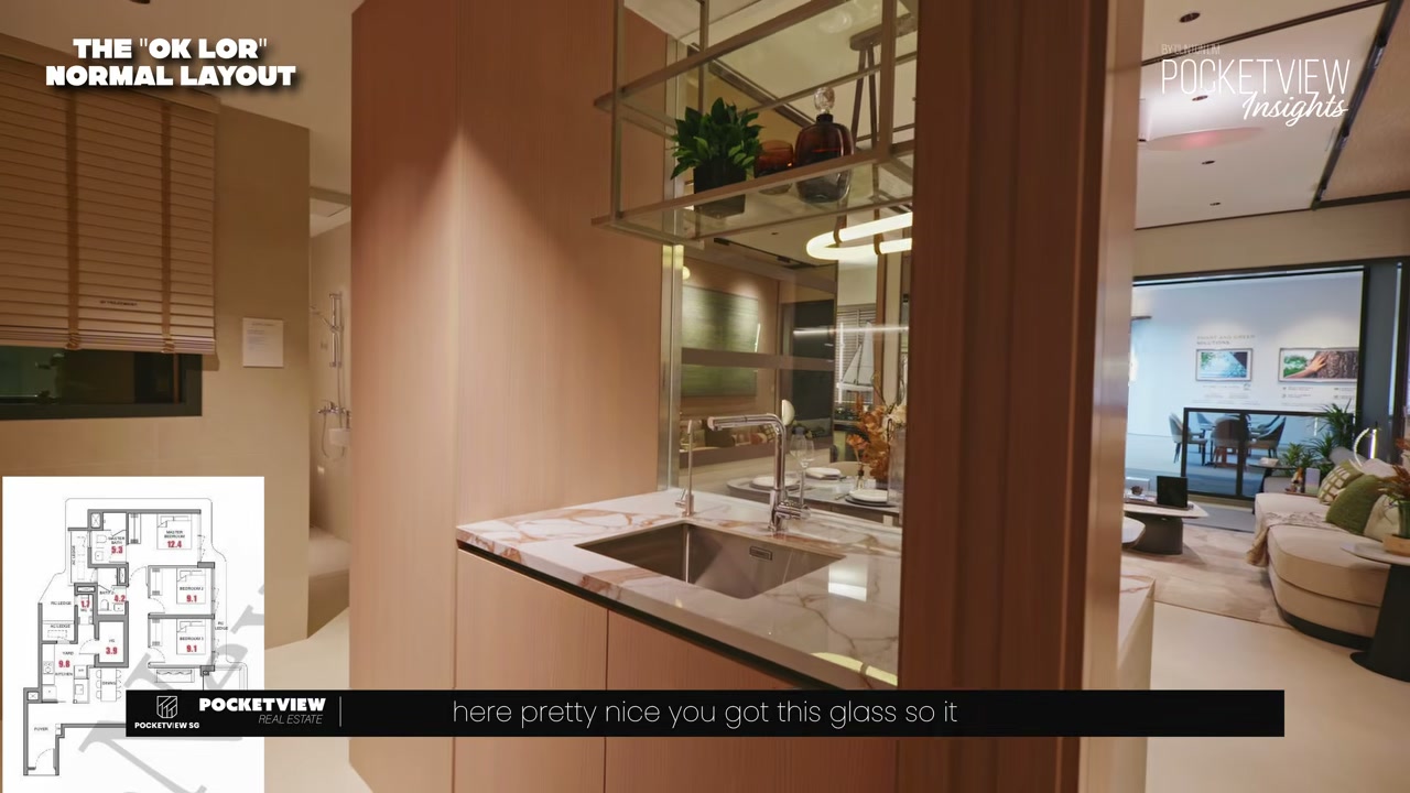 Layout 1 open-concept kitchen in the 1,033 sqft 3-bedroom premium, with a glass partition above the marble countertop opening into the dining area.