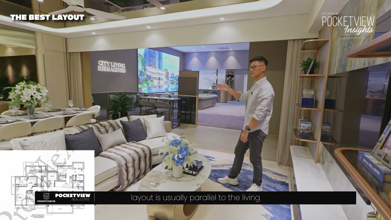 Layout 3 living-dining area in the 2,131 sqft 5-bedroom, with a 6.5 m wide landscape orientation, a long sofa and dining table set, and the show flat's 'City Living Reimagined' wall behind the entertaining area.